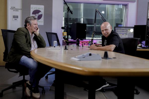 GRANT LEE PHILLIPS AT TABLE WITH MATT PINFIELD ON RIGHT DURING INTERVIEW